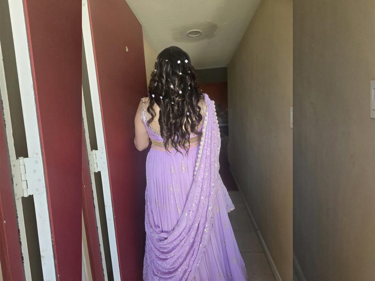 Full curled hairstyle with lavender outfit